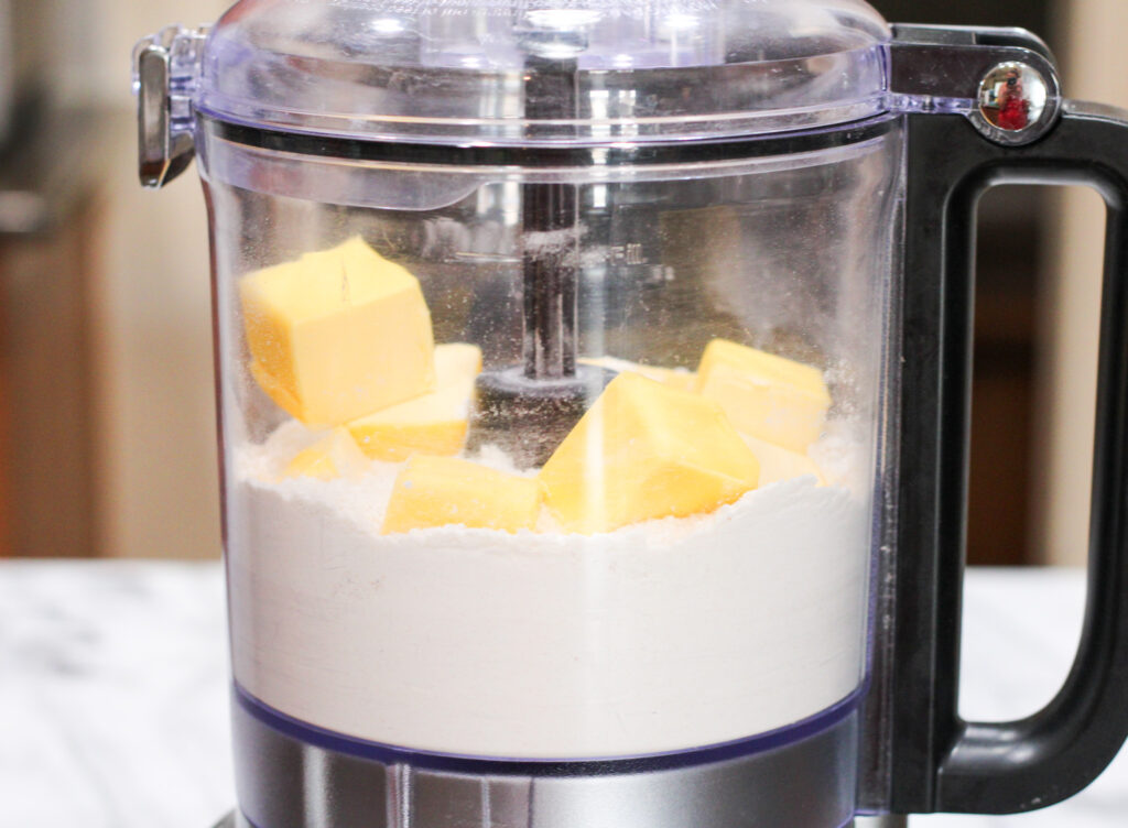 Butter and flour in food processor. 