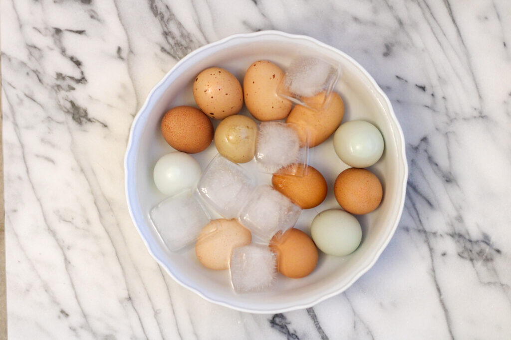 Boiled eggs in ice bath.