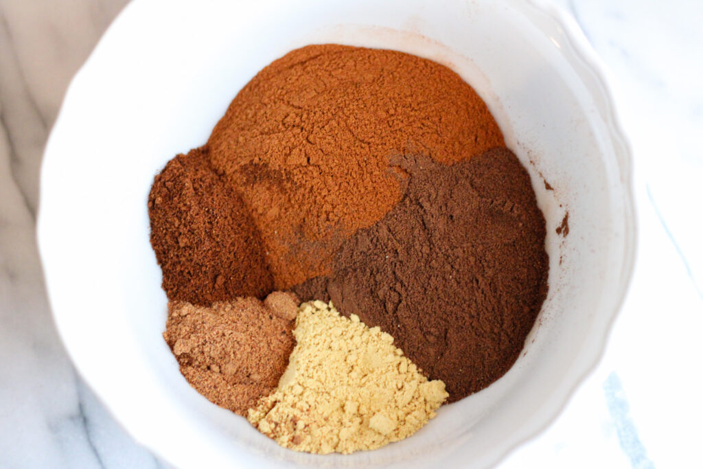 Mix of spices in bowl for pumpkin spice blend.