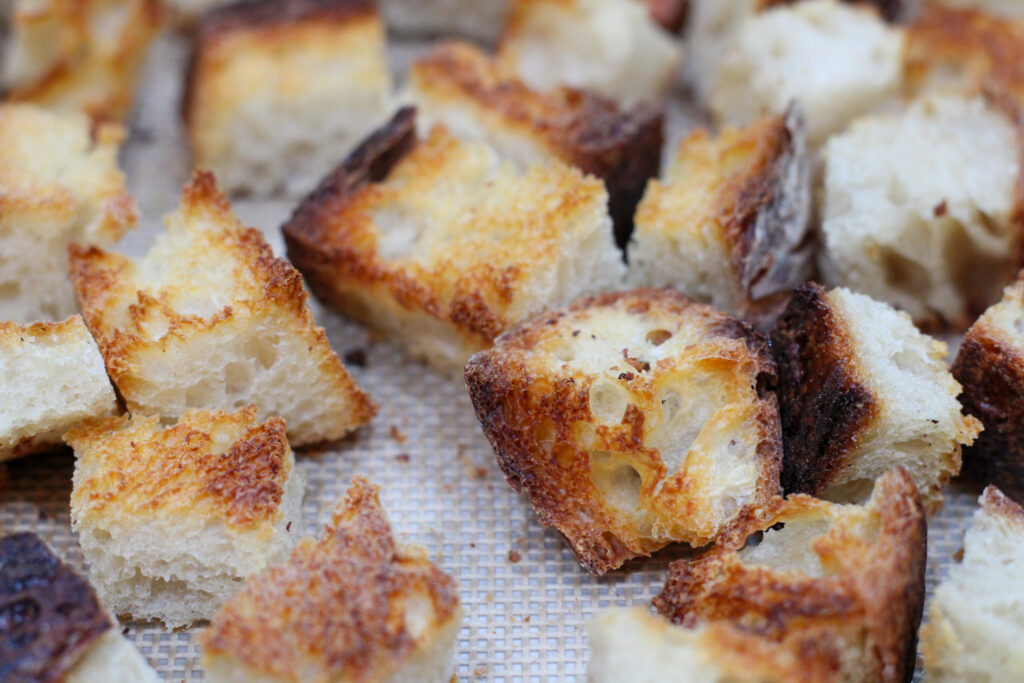 Toasted cubes of sourdough bread.