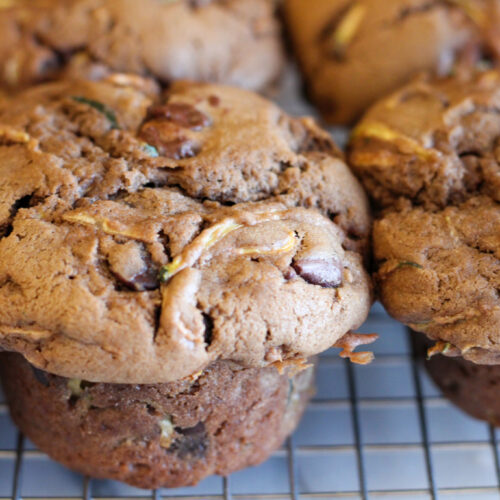 Closeup of Sourdough chocolate chip zucchini muffins on cooling rack.