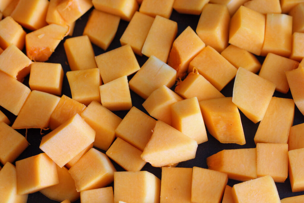 Cubed butternut squash on tray.