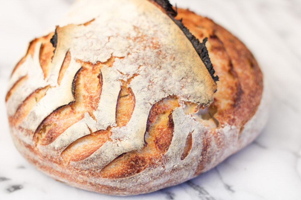 Loaf of sourdough herb bread.