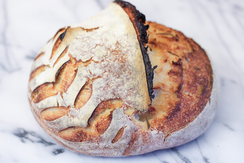 Loaf of sourdough herb bread.